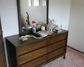 What an outstanding piece of Mid Century Modern dresser and mirror combination
