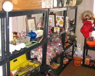 full shelves including a trumpet and a large ceramic bunny in the corner