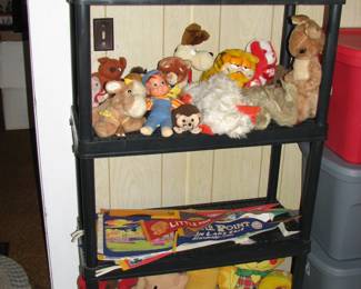 vintage and modern stuffed animals and some pennants 