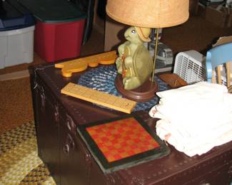 trunk, feed sack curtains and a turtle lamp