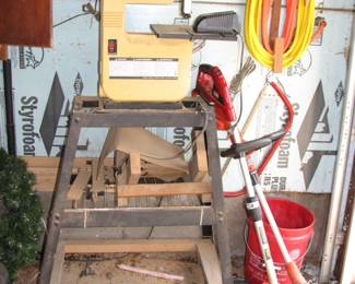 band saw, weed whips,  air hose 