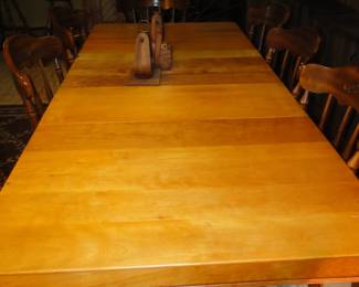 Handcrafted of solid wood, this large table can serve a lot of people