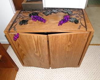 Two door storage cabinet, with nice grape cluster brackets