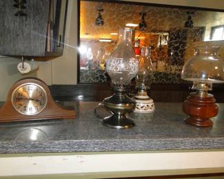 Mantle clock, and oil lamps, all vintage