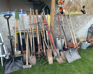 Shovels, rakes, ladder, watering can