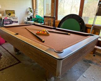 Mid century pool table on main level with easy removal access 