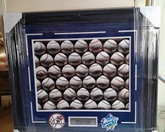 Framed Collage Of The NY Yankees 1998 World Series Champs "The Greatest Season Ever 125-50" With Plaque & 2 Emblems. (Uncertified). Measures 29x28.