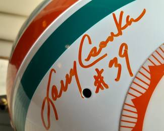 Miami Dolphins Full Size Helmet Signed By 10 Members From The 1972 Undefeated Super Bowl 7 Champion Team. Signed By Players Jim Langer #62, Jim Kiick #21, Paul Warfield #42, Bob Griese #12, Larry Csonka #39, Nick Buoniconti #85, Mercury Morris #22, Laury Little #66, Jake Scott #13, & Dan Shula. (Uncertified)
