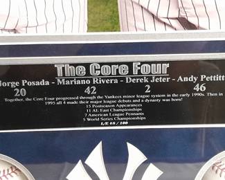 Framed Shadowbox Display Case With The NY Yankees Core Four Photograph & 4 Baseballs Autographed By Jorge Posada, Mariano Rivera, Derek Jeter, & Andy Pettitte. (Certified By Steiner Sports With 4 Identification Cards - 1 For Each Baseball). Measures 27x27.