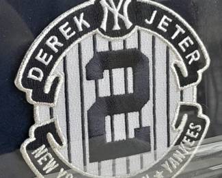 Framed Collage Of Derek Jeter With Replica 1992 Scouting Report, Photograph, Plaque, & Genuine Captain Patch. (Uncertified). Measures 17.5x19.