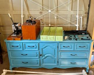 Gorgeous Painted Wood Dresser;  Antique Cast Iron Bed Frame;  Button Making Device in Carry Box;  Trio of Metal Drawers;  Music Stands;  Wall Hooks