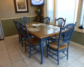 Painted blue French Country kitchen table with 6 rush seat chairs
