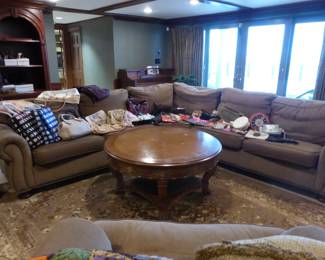 Sectional sofa, coffee table, area rug, assorted handbags