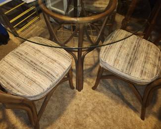 Rattan and glass dining table and 4 chairs