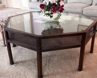 Octagonal coffee table with shelf below the glass top