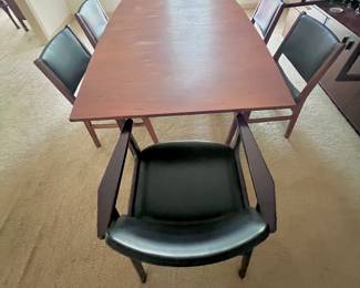 A simple & functional wood dining room set with six chairs.