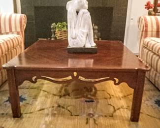 Beautiful frontal view of mahogany table & back view of stone statue