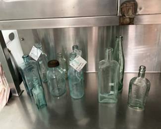 large collection of antique bottles