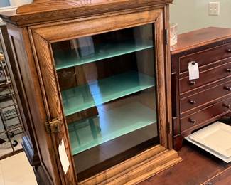 turn of the century cabinet with original wavy glass