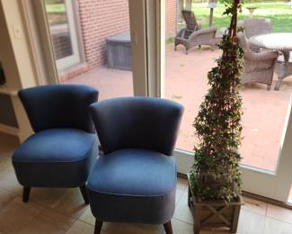 2 chairs and an cute decorative tree
