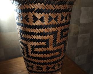 This is a child size carrying basket, woven by The Ko Ho Tribe of South Vietnam. It is becoming brittle in this dry climate.  It would have made a very fine file.