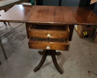 Antique drop leaf table with 2 drawers