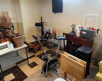 Wicker baskets, set of 4 tv tables, sewing machine, threads and such and a hideaway sewing table. 