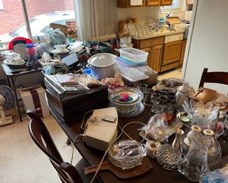 Under there is a great dining room table with 2 extra leafs and 6 chairs. Protected under table pad (included). This will be a steal for who buys this. Priced to go like everything. 