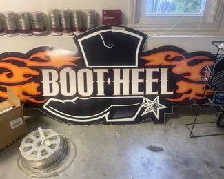 This is a very large Bootheel Harley sign. At least six feet long. So unique!