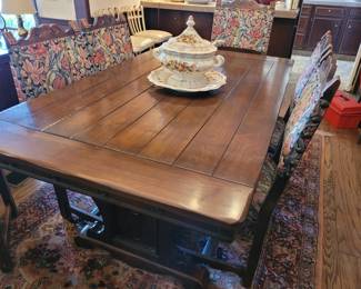 1920's walnut Spanish Revival trestle table with 6 chairs and 4 leaves
