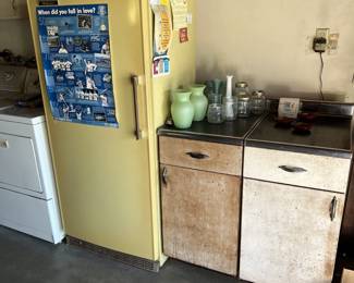 Next to the washer and dryer is this tall freezer.