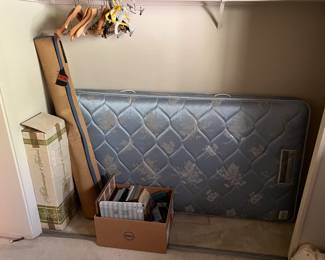 This is primarily a good amount of hangers, a mattress (twin size?), and boxes of hidden treasures.