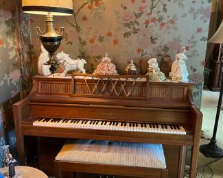 This is the Chickering spinet piano and piano bench.