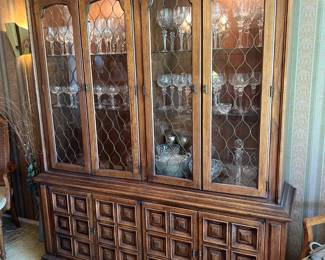 This china cabinet is lighted and is made by Drexel.