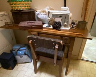 Singer Touch Sew zig zag, model 646, in cabinet with sewing notions
