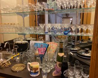 Barware, gold rimmed wine glasses and various beer steins and Weatherly Stemware by Lennox and Princess House etched, white red champagne glasses