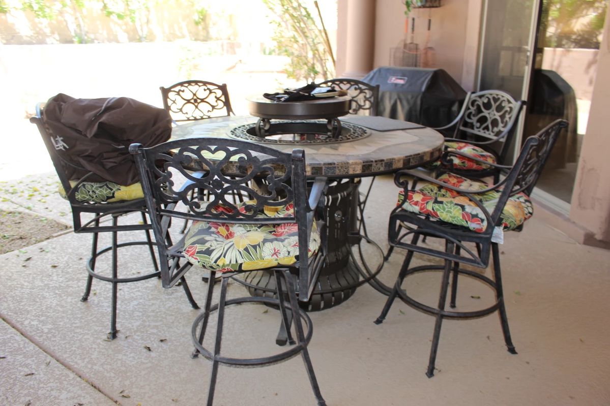 A great patio set for sale - the middle table has a fireplace built within! Great condition!