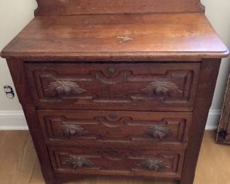Antique small dresser with oak leaf drawer handles 