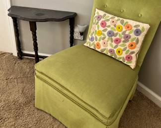 Green accent chair and table