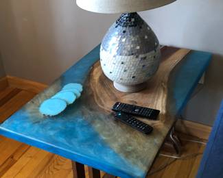 Wood & epoxy side table with one of a pair of lamps 