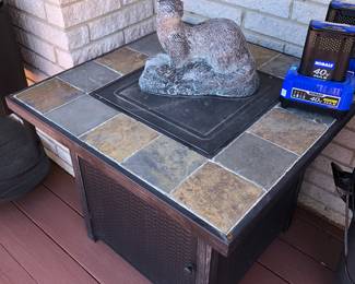 Tile top fire pit for a propane hook up & Otter figurine 