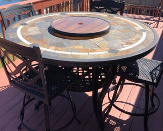 Starting with outdoors for the Season! Nice round tile top - counter height table with six swivel chairs - lazy/susan center 