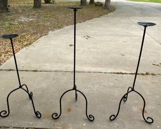 A set of 3 metal tall candle holders. Super cool.