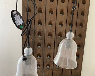 A set of hanging Pottery Barn lights that plug in.