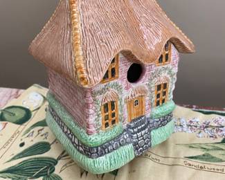 Small ceramic cottage birdhouse