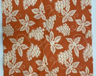 Vintage orange flour sack fabric with grape motif