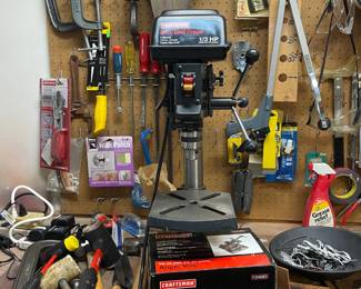 . . . Craftsman drill press surrounded by tons of tools