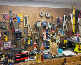 . . . wall-to-wall pegboard full of tools