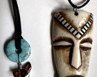 2 Necklaces: African Mask & Shark's Tooth With Turquoise Bead
Lot #: 95