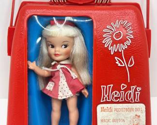Vintage 1960s Heidi Pocketbook Doll In Original Case By Remco Industries
Lot #: 124